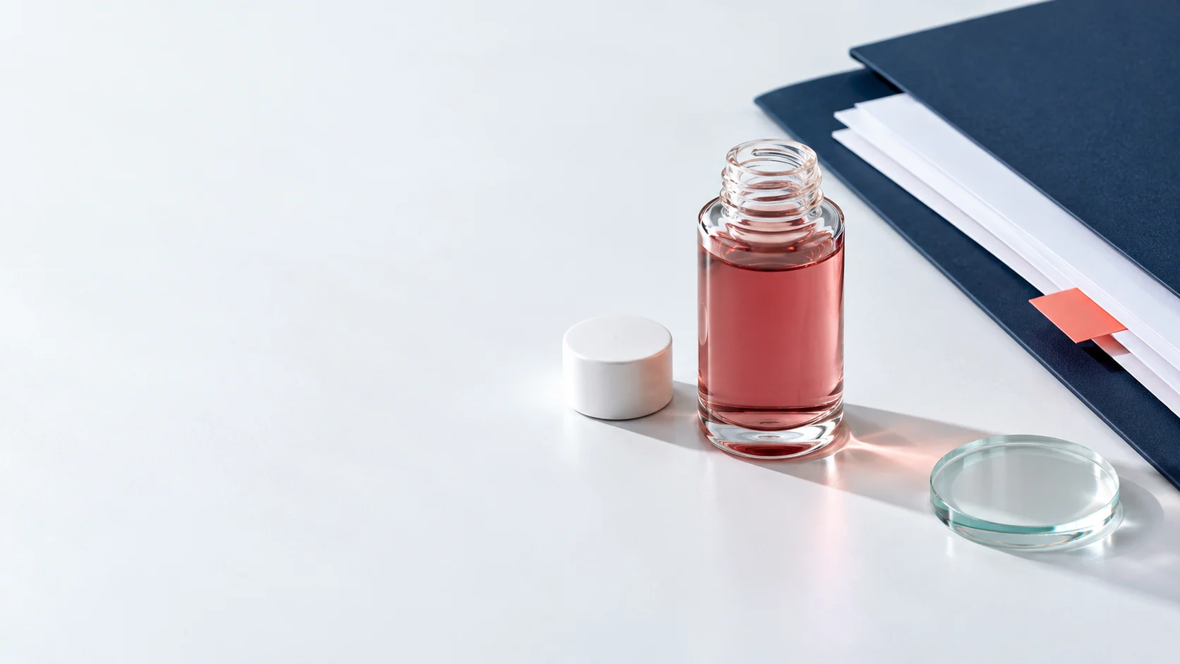 Unbranded samples and technical papers arranged on a light tabletop